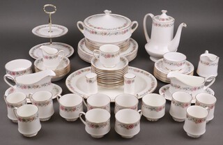A 64 piece Paragon/Royal Albert Belinda pattern dinner service comprising  twin handled tureen and cover, meat plate, 6 dinner plates, 6 side plates, 8 tea plates, 2 sauce boats and stands, 6 pudding bowls, 2 tier cake stand, 7 cups, 12 saucers, coffee pot, 2 sugar bowls, milk and cream jug,  6 coffee cups, salt and pepper