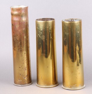 Two First World War brass 18lb shell cases marked 1918 together with 1 other marked 75E E C