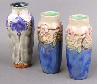 A pair of Royal Doulton blue and brown salt glazed floral patterned vases, bases impressed Royal Doulton X8971B 21505, 22cm, 1 other base impressed 7822B 25cm (large chip to rim) 