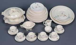 A 47 piece Royal Doulton The Coppice Pattern dinner service comprising 3 oval graduated meat plates, oval twin handled plate, angular dish (chipped), platter (chipped), twin handled soup tureen and cover (lid cracked), 8 dinner plates (3 ring flat), 6 side plates (2 ring flat), 5 large tea plates, 7 small tea plates (1 chipped, 1 a second, 1 cracked), sauce boat, cream jug, sugar bowl (glued), 6 coffee cups (1 chipped), 6 saucers (1 stuck, 1 chipped, crazing throughout) 