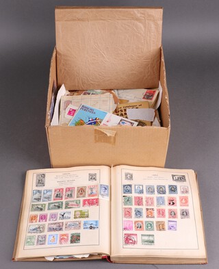 An album of George VI and commonwealth stamps, album of world stamps and a collection of loose stamps, all contained in a cardboard box