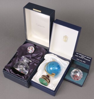 A Caithness scent bottle and stopper 12cm boxed, a Prince of Wales and Lady Diana Spencer 1981 Royal Wedding paperweight boxed and a P&O Canberra world cruise 1993 globe boxed 