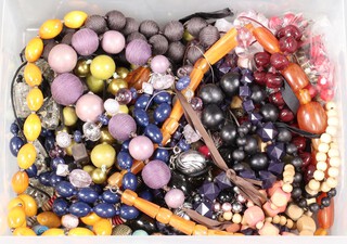 A quantity of costume jewellery including beads, contained in a plastic box 