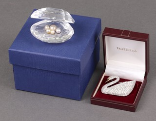 A Swarovski Crystal model of a clam 7cm boxed and a Swarovski Crystal brooch in the form of a swan boxed 