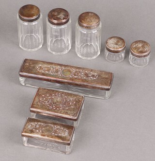 A Victorian cut glass pin jar with silver plated lid and 7 other dressing table jars 