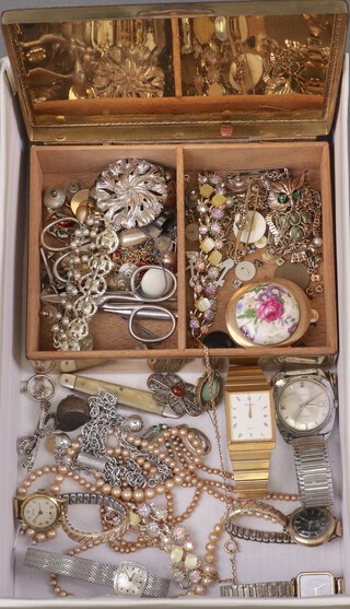 A silver plated cigarette box with hinged lid, a Timex wristwatch, other wristwatches and costume jewellery 