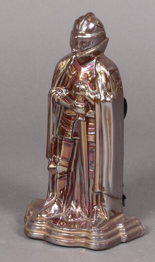 An anodised fireside companion set in the form of a standing knight 36cm 