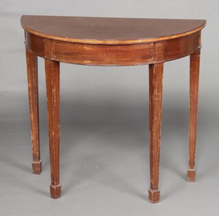 A Georgian style mahogany demi-lune side table, raised on square tapered supports with spade feet 77cm h x 85cm w x 43cm d (contact marks in places) 
