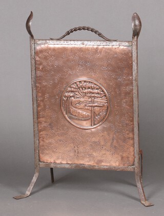 An Art Nouveau embossed copper and wrought iron fire screen decorated a setting sun 81cm h x 30cm w  