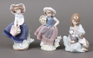 Three Lladro figures - Sweet Scent 05221, Pretty Pickings 05222 and Cat Nap 05640