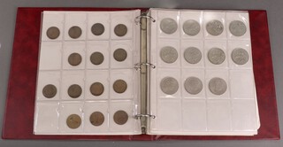 A ring bound album of British coinage including threepenny bits, half pennies, farthings, Jubilee crowns 