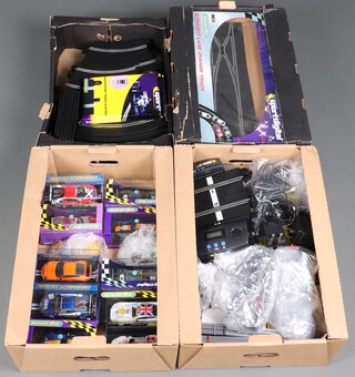 A collection of Scalextric boxed digital cars to include Porsche 997, TVR T400R, Ferrari F430 GT, Ford GT40, Dodge Viper Competition Coupe, Aston Martin Racing DBR9 (x2), Nissan Z2004, etc and also including track, buildings, grand stand and scoreboard 