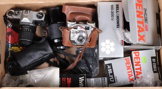 Cameras - a collection of vintage SLR cameras and lenses to include a Kodak Synchro 300, a Pentax K1000, a Pentax ME Super (boxed) and a Pentax A50mm F1.7 and a AF-200S lens, Vivitar lens and a Bell & Howell 100-200 F4.5mm lens etc