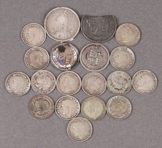 A small collection of British silver coins including sixpences