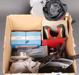 A Hammant and Morgan Duette control unit boxed, a Hornby tunnel, a Dublo DA45 platform and kiosk boxed and a quantity of various rails etc, all contained a cardboard box 