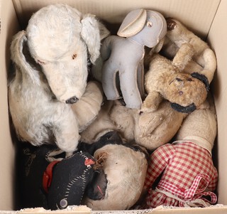 A felt figure of a dog, felt figure on an elephant (some moth) and a collection of teddybears etc 