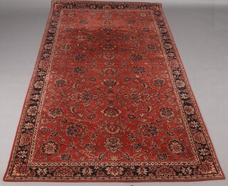 An orange and black ground chenille and Persian style table cover/wall hanging with floral decoration 256cm x 131cm 