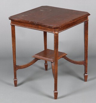 An Edwardian square oak occasional table raised on square tapered supports with undertier and spade feet 32cm h x 60cm (ring and contact marks in places)