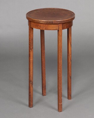 A 1930's circular oak jardiniere stand on square supports 60cm x 31cm 
