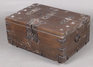 An Eastern hardwood trunk with hinged lid and iron drop handles 40cm h x 87cm w