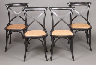 A set of 4 ebonised cafe style chairs with X framed backs 