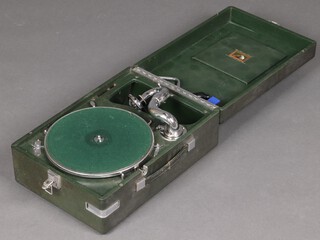 A His Masters Voice portable gramophone contained in a green case 15cm h x 28cm w x 40cm d 