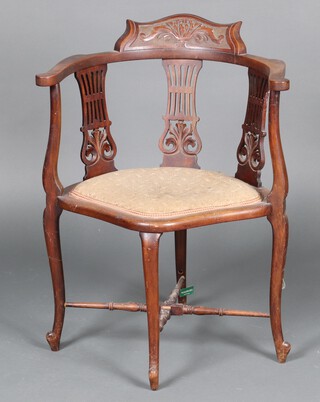 An Edwardian carved walnut corner chair with splat back, shaped seat on cabriole supports with X framed stretcher 