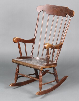 A 1980's beech framed rocking chair