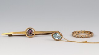 An Italian gold marked 9k fine link chain hung a blue coloured pendant, paste set eternity ring and a gold marked 9ct amethyst set bar brooch (a/f)