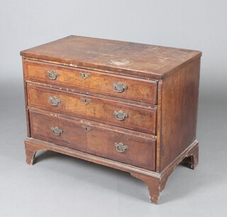 A Queen Anne oak lined walnut chest with feather banded top, fitted 3 long drawers with original handles, raised on bracket feet 72cm h x 93cm w x 52cm d 