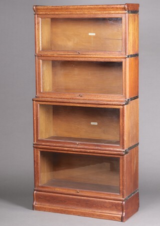 A Globe Wernicke 4 tier graduated oak bookcase 182 h x 86cm w x 35cm d 