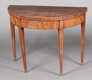 A Georgian mahogany demi-lune card table, raised on square tapered supports, spade feet 70cm h x 91cm w x 45cm d 