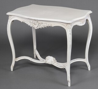 A 19th Century continental carved and painted hardwood occasional table of serpentine outline, raised on cabriole supports with X framed stretcher 78cm h x 98cm w x 65cm d 