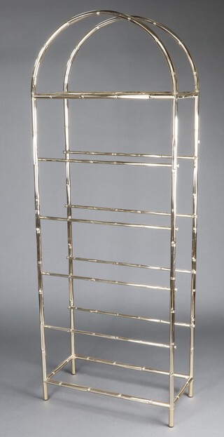 A 20th Century tubular gilt metal of faux bamboo form, 6 tier what-not stand with plate glass shelves, 203cm h x 76cm w x 36cm d 