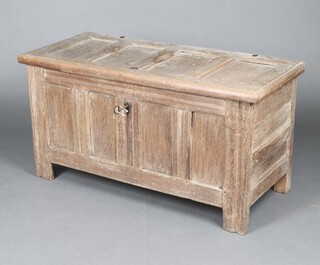 A 17th/18th Century continental bleached oak coffer of panelled construction, 63cm h x 120cm w x 52cm d 