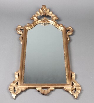 A 1950's arched plate Italian mirror contained in a carved gilt painted wooden frame 99cm h x 52cm w 