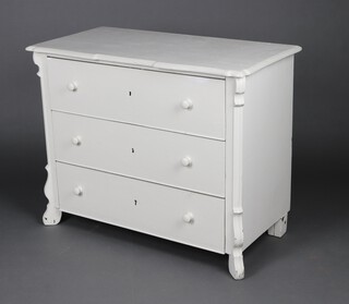 A 19th Century continental white painted pine chest of 3 drawers with turned handles, on scrolled supports 84cm h x 104cm w x 54cm d 