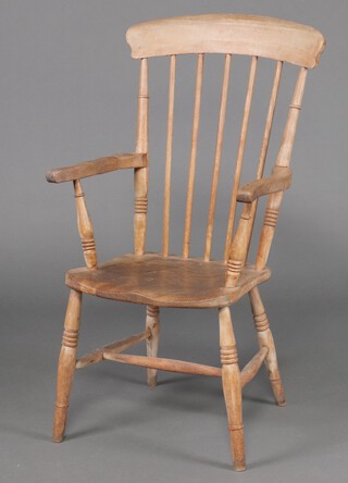 A 19th Century pine and elm Windsor bar back kitchen chair 