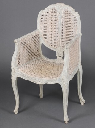 A 19th Century French  white painted and double cane salon armchair, raised on cabriole supports 