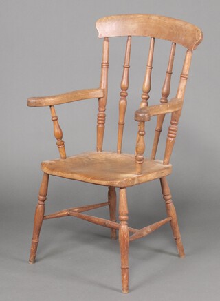 A Victorian bleached beech and elm bar back kitchen carver chair with turned supports and H framed stretcher  