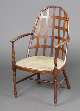 An Arts and Crafts bentwood tub back chair with lattice work back and upholstered seat, raised on turned supports with H framed stretcher (seat formerly caned) 