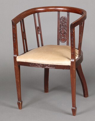 An Edwardian mahogany tub back chair with upholstered seat, raised on square tapered supports, spade feet 