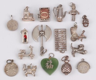 Fifteen various silver charms, 42g gross, together with a green heart shaped hardstone charm and 1 other (17)