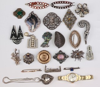 A Sterling niello set brooch decorated a figure, a Sterling and abalone brooch in the form of a bird and other brooches  