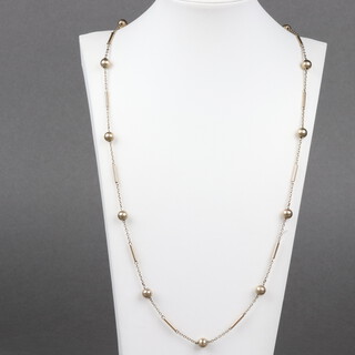 A 9ct gold necklace with interspersed ball decoration, 82cm, 17g