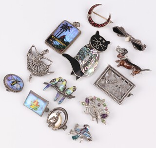 A rectangular butterfly pendant marked Rio, an enamelled brooch in the form of a Dalmatian, ditto bird and a collection of other brooches 