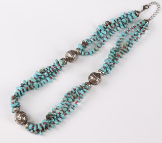 A turquoise, coral and white metal bead necklace 