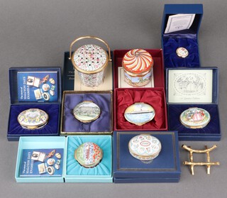 A circular Halcyon Days enamelled pail and cover 6cm, a ditto carousel musical trinket box with hinged lid and 5 other Halcyon Days enamelled boxes, all boxed and 2 others