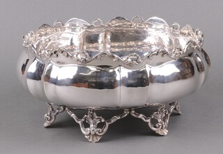 An Egyptian circular white metal bowl with pierced border on panel supports 24cm 