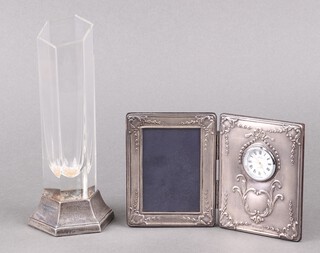 An embossed silver table clock with enamelled dial and photograph frame to commemorate the Oriana World Cruise 1997, Sheffield 1996 11cm x 18cm, together with a silver and cut glass mounted vase to commemorate P & O Oriana Millennium World Cruise Sheffield 2000 